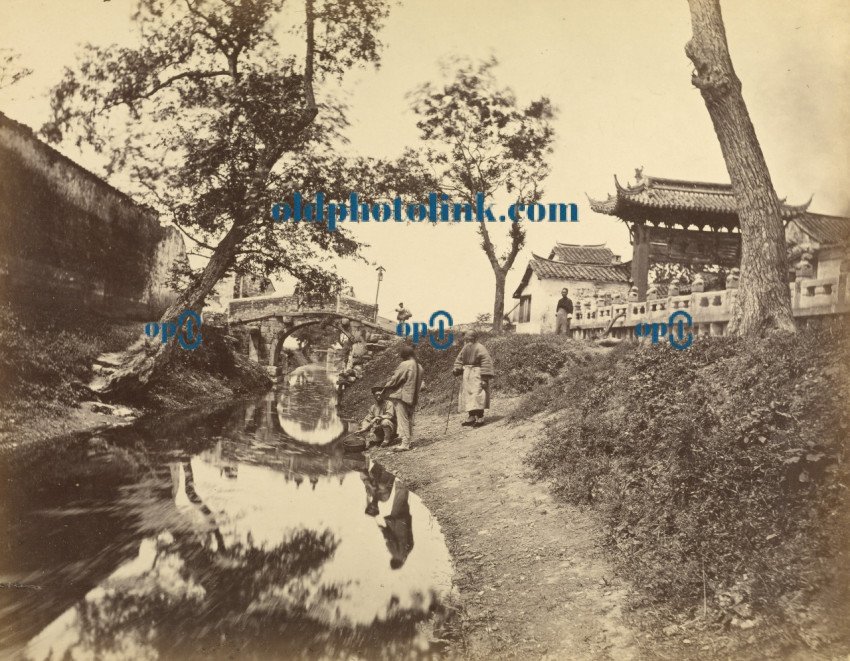 Chinese view of a river and a bridge in a village including several Chinese people 1870