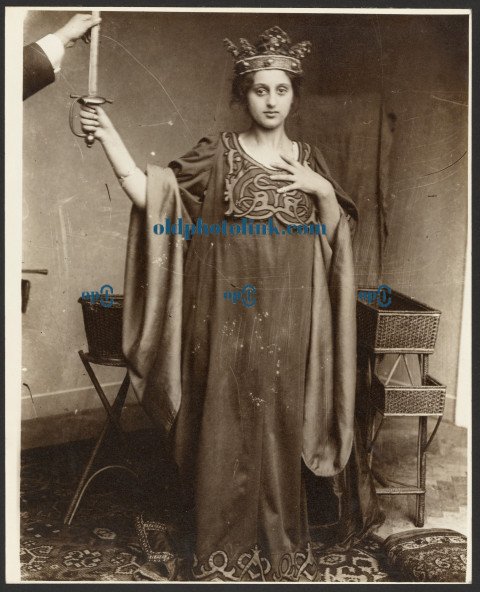 Female Model Wearing Crown and Holding Sword 1900