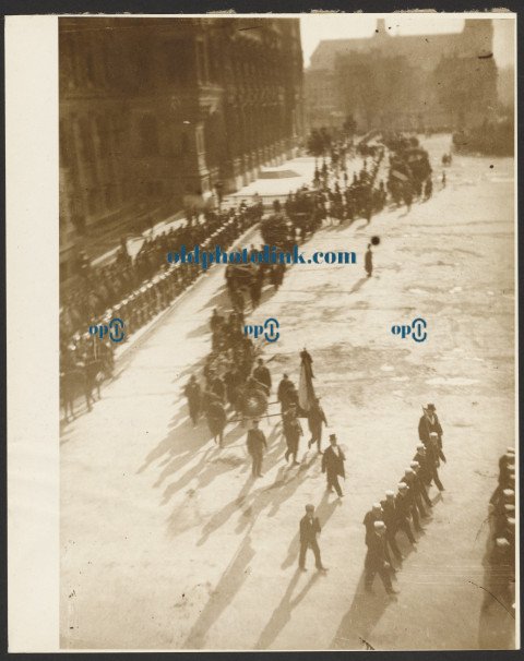 Procession of Uniformed Men in an Unidentified Town Square 1900