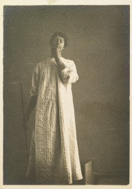 Woman in a chemise, hand over her mouth 1890