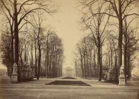 View down tree lined path towards palace 1860